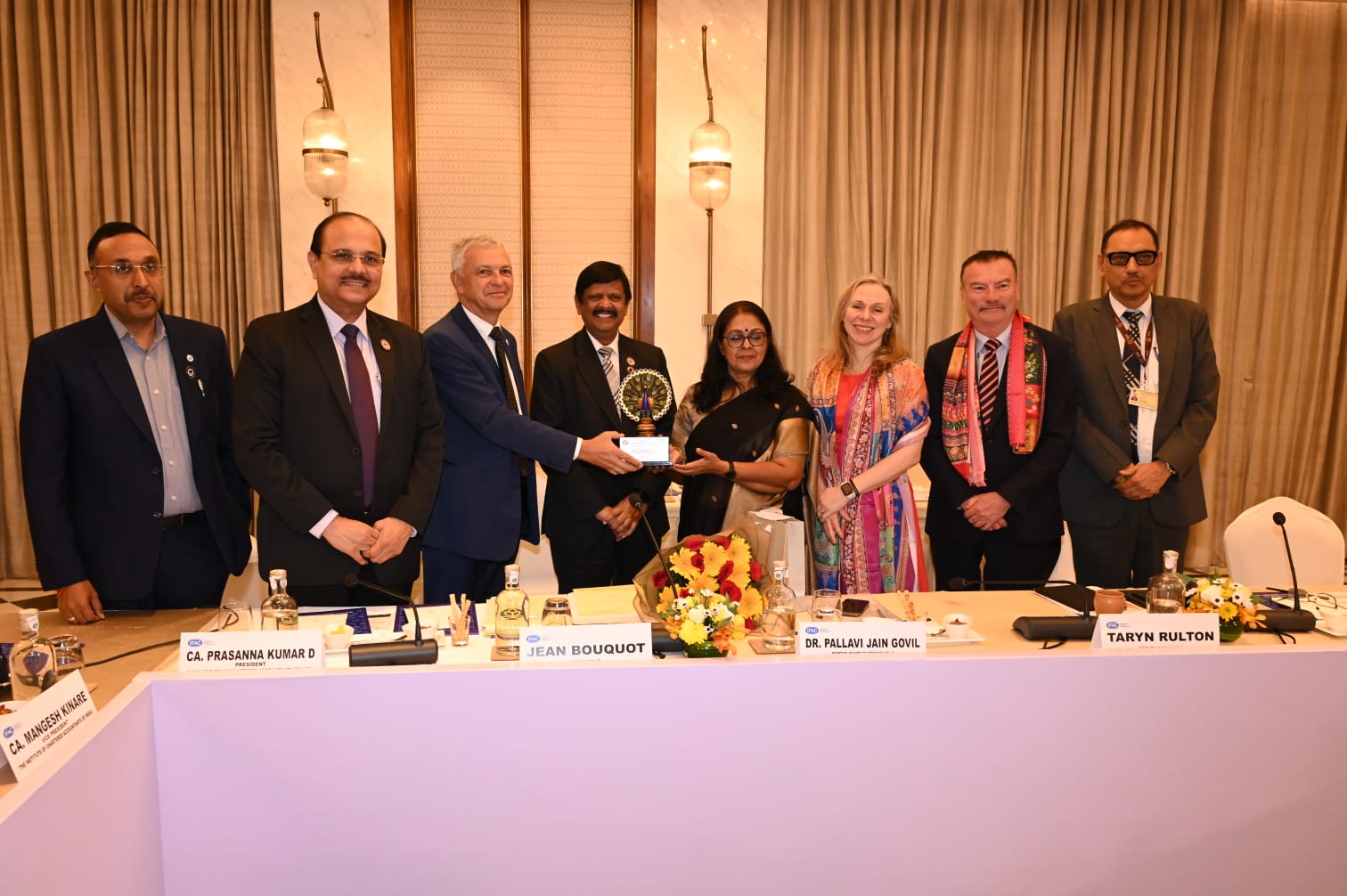 Dr. Pallavi Jain Govil, Secretary, Ministry of Corporate Affairs along with Mr. Jean Bouquot, President - IFAC; Ms. Taryn Rulton, Deputy President - IFAC; Mr. Lee White, Chief Executive Officer - IFAC; CA. Prasanna Kumar D, President, ICAI; CA. Mangesh Kinare, Vice-President, ICAI; CA. Atul Kumar Gupta, Past President, ICAI and CA.(Dr.) Jai Kumar Batra, Secretary, ICAI.
